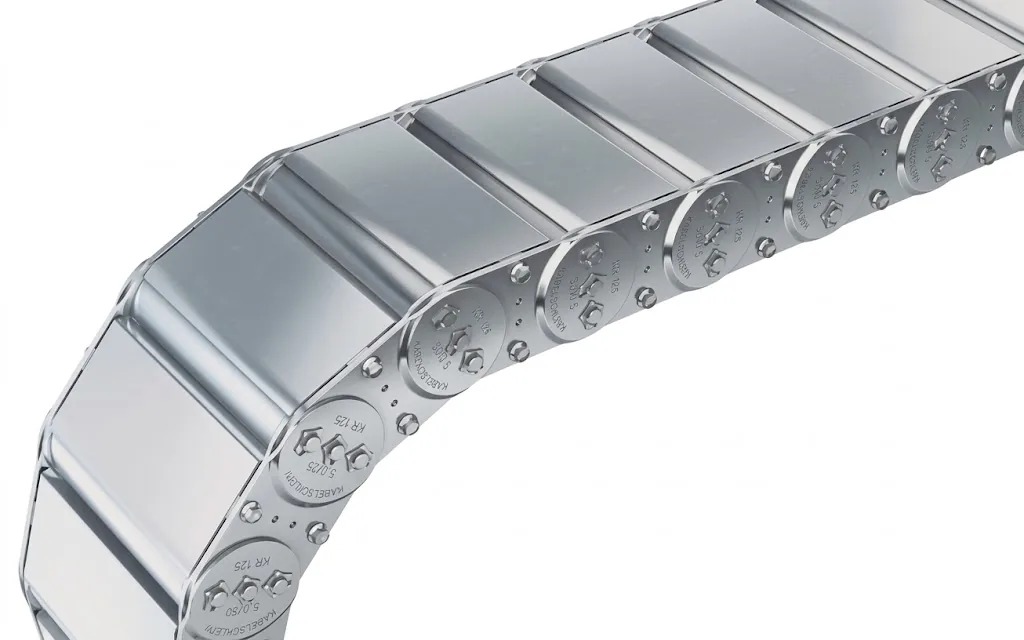 Detailed view of a silver-coloured, curved cable carrier with round pivot points and screws