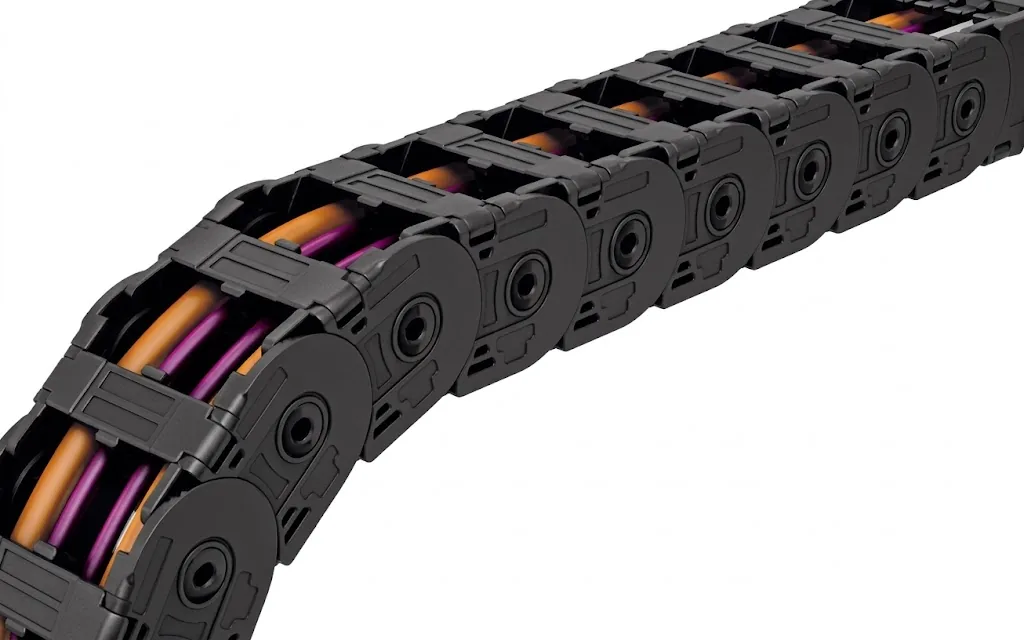 Black cable carrier with orange and purple cables inside, diagonally from left to top right
